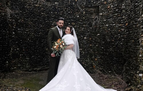 Bride with Groom in the ruins of a castle turret.